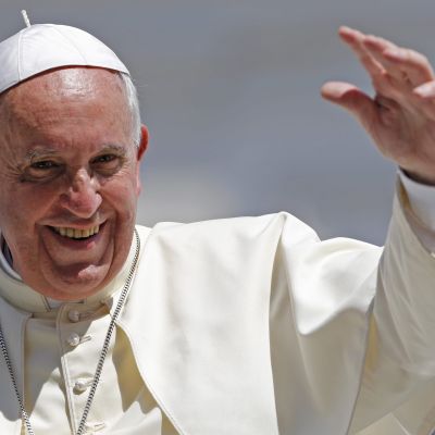 Pope Francis waves after leading his weekly general audience at St. Peter's Square at the Vatican