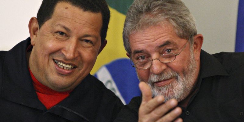 Brazil's President Lula and Venezuela's President Chavez smile during a ceremony in Salvador City