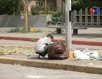 web3-venezuela-shortages-garbagge-eating-street-voice-of-america-pd
